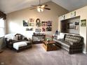 Comfortable living room with a ceiling fan, neutral carpet, and bright natural light at 1027 Springway Dr, Shelbyville, IN 46176