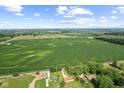 Expansive aerial view of a home surrounded by vast fields, showcasing the rural setting and serene countryside landscape at 10727 N Shupe Rd, Monrovia, IN 46157