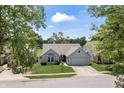 Charming single-Gathering home with a well-manicured lawn and attached two-car garage at 10753 Seaview Ln, Indianapolis, IN 46236