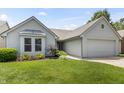 Charming single-Gathering home with a well-manicured lawn and attached two-car garage at 10753 Seaview Ln, Indianapolis, IN 46236