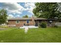 Backyard view with screened-in porch and plenty of green space at 13 Fairlane Dr, Brownsburg, IN 46112
