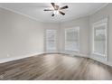 Inviting bedroom with lots of natural light, neutral paint, modern ceiling fan and flooring at 1310 California St, Columbus, IN 47201