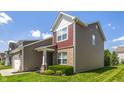 View of the home's side exterior showcasing well-maintained landscaping and architectural details at 13992 Wynngate Ln, Fishers, IN 46038