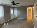 Cozy living room featuring neutral walls, carpet and ceiling fan with light at 1610 Douglas Ln, Lebanon, IN 46052