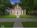 Charming two-story home with red shutters, pristine lawn, and inviting walkway to the front door at 228 W Washington St, Shelbyville, IN 46176