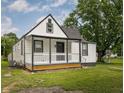 Charming home featuring a covered front porch, and a beautiful lawn, perfect for outdoor enjoyment at 3822 Haverhill Dr, Anderson, IN 46013