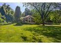 A beautiful house is surrounded by lush green grass and trees providing an idyllic and peaceful setting at 4446 Lakeridge Dr, Indianapolis, IN 46234