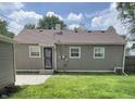 Backyard features a well-kept lawn, neutral exterior, and functional layout, perfect for outdoor enjoyment and relaxation at 4761 Payton Ave, Lawrence, IN 46226