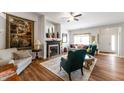 Bright living room with a fireplace, hardwood floors, and a welcoming atmosphere at 564 Parkhurst Ct, Greenwood, IN 46142