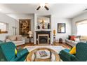 Comfortable living room featuring a fireplace, vaulted ceiling, and stylish furnishings at 564 Parkhurst Ct, Greenwood, IN 46142
