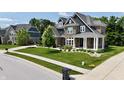Beautiful two-story home features stone and siding, a well-manicured lawn, and established landscaping at 5706 Bentbrook Dr, Bargersville, IN 46106