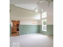 Inviting living room featuring an open floor plan, vaulted ceiling, and lots of natural light at 6937 Thousand Oaks Dr, Indianapolis, IN 46214