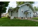This home features a well-maintained lawn and a generator for backup power at 7727 Huff St, Indianapolis, IN 46259