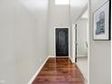 Entryway features hardwood floors, neutral paint, and a view into an adjacent room at 773 Bracknell Dr, Avon, IN 46123