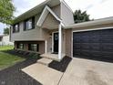 Charming two-story home with a well-manicured lawn and a two car garage at 8277 N Waterford Dr, Columbus, IN 47201