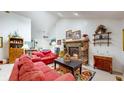 Cozy living room featuring a brick fireplace, high vaulted ceilings, and neutral colored walls at 1067 Acadia Ct, Indianapolis, IN 46217