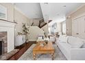 Open living room with hardwood floors, fireplace, and stairs to the second floor at 1531 N College Ave, Indianapolis, IN 46202