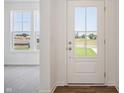Entryway with natural light, hardwood floors, and view of the outside at 2151 Bear Oak Way, Shelbyville, IN 46176