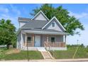 Charming two-story home with a welcoming front porch and well-maintained landscaping at 2170 S East St, Indianapolis, IN 46225