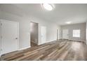Bright living room featuring hardwood floors, ample natural light, and neutral paint at 2170 S East St, Indianapolis, IN 46225
