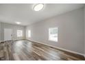 Bright living room featuring hardwood floors, ample natural light, and neutral paint at 2170 S East St, Indianapolis, IN 46225