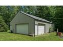 Spacious detached garage with dual doors and ample storage space, set in a grassy yard at 290 S Buffalo Hill Rd, Martinsville, IN 46151