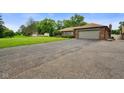 A well-maintained ranch home boasting an attached garage and a lush, green lawn at 3707 E Wilson Dr, Mooresville, IN 46158