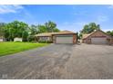 Lovely ranch home showcasing an attached garage and meticulously maintained landscaping at 3707 E Wilson Dr, Mooresville, IN 46158