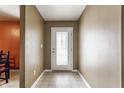 Bright hallway with tile flooring and a front door with glass panes, offering a welcoming entrance at 3872 Dusty Sands Rd, Whitestown, IN 46075