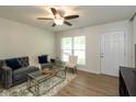 Inviting living room with hardwood floors, modern furniture, and ample natural light at 717 Berkeley Dr, Shelbyville, IN 46176