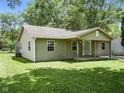 A cozy home featuring a covered porch with wooden columns and neutral vinyl siding at 7434 N Green Meadows, Fairland, IN 46126