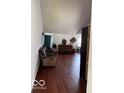 Bright living room with hardwood floors and comfortable seating arrangement at 8113 Maple Stream Ln, Indianapolis, IN 46217