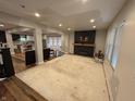 Open concept living room with wood floors and a fireplace at 917 N Rural St, Indianapolis, IN 46201