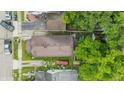 An overhead aerial shot displays the compact backyard and the layout of the property within its neighborhood setting at 1011 W 7Th St, Anderson, IN 46016
