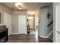 Inviting foyer with gray walls, wood floors, and neutral decor, leading to the main living areas at 10334 Deercrest Ln, Indianapolis, IN 46239
