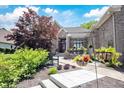 Beautiful home featuring a meticulously landscaped front yard with a covered entrance at 10707 Burning Ridge Ln, Fishers, IN 46037