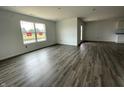 Open-concept living room with durable floors and bright natural light, perfect for entertaining and relaxation at 1175 Mcbride St, Greenfield, IN 46140
