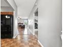 Inviting entryway featuring tile floors, leading to the living area with hardwood floors and ample natural light at 19489 Prairie Crossing Dr, Noblesville, IN 46062