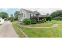 A charming home with a well-manicured lawn, mature trees and a cozy, inviting curb appeal at 2249 Maple St, Columbus, IN 47201