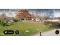Lush green lawn and trees surround the property in a well-maintained residential neighborhood at 2875 E Woodside Dr, Mooresville, IN 46158
