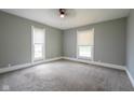 Bright and airy bedroom featuring carpeted floors, neutral paint, and large windows at 410 Plum St, Frankton, IN 46044