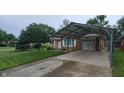 Single-story brick home with carport for two vehicles and well-maintained landscaping at 420 Brookside Ln, Plainfield, IN 46168