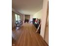 Bright and airy living room boasts hardwood floors, a fireplace, and large windows for natural light at 4609 Andover Rd, Indianapolis, IN 46226