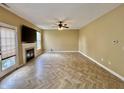 Spacious living room with modern flooring, fireplace, and plenty of natural light at 5571 Auburndale Dr, Bargersville, IN 46106
