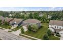 An aerial view of a two-story home nestled in a lush, green, residential neighborhood at 5917 Bartley Dr, Noblesville, IN 46062