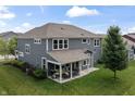 Expansive backyard featuring a covered patio perfect for outdoor dining and relaxation at 5917 Bartley Dr, Noblesville, IN 46062