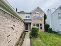 Two-story brick home with a well-kept lawn and neatly trimmed shrubs at 5938 Tybalt Ln, Indianapolis, IN 46254
