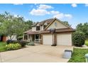 Beautiful home with a lush front yard, driveway, and a two-car garage with a basketball hoop at 6050 Acorn Dr, Columbus, IN 47201