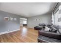 Spacious living room with hardwood floors and comfortable seating, creating a relaxing atmosphere at 6143 Schoolwood Dr, Indianapolis, IN 46224