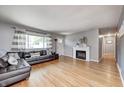 Bright living room with hardwood floors and stylish decor, offering a welcoming space at 6143 Schoolwood Dr, Indianapolis, IN 46224
